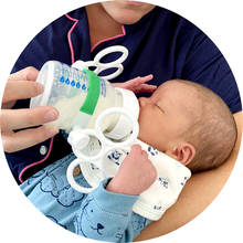 Load image into Gallery viewer, Baby using Bottle Grabbies