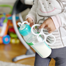 Load image into Gallery viewer, Toddler Drinking Milk With Bottle Grabbies